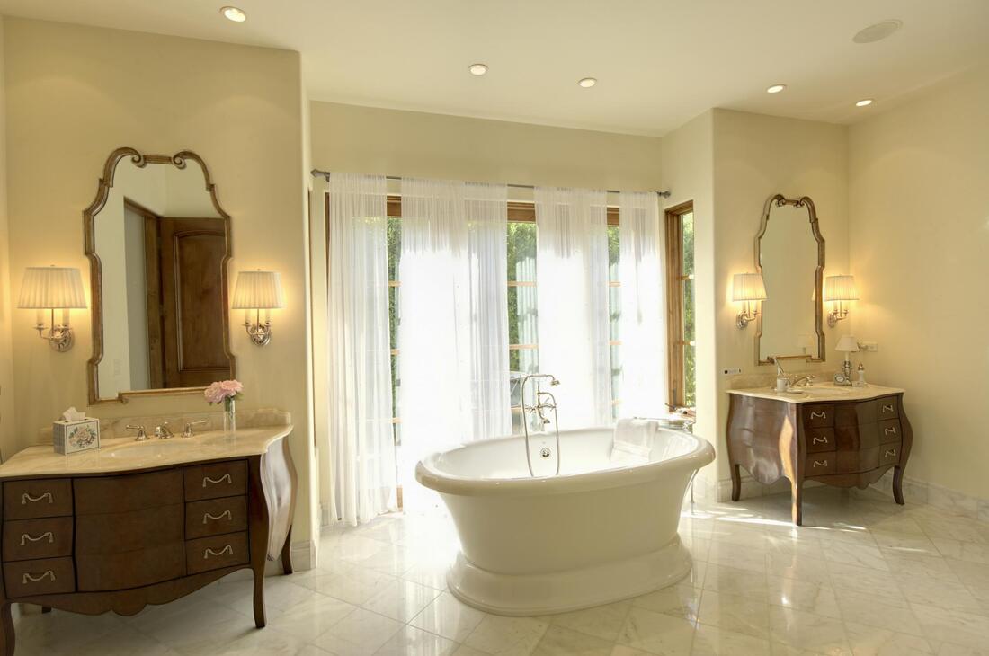 a bathroom with white round bathtub